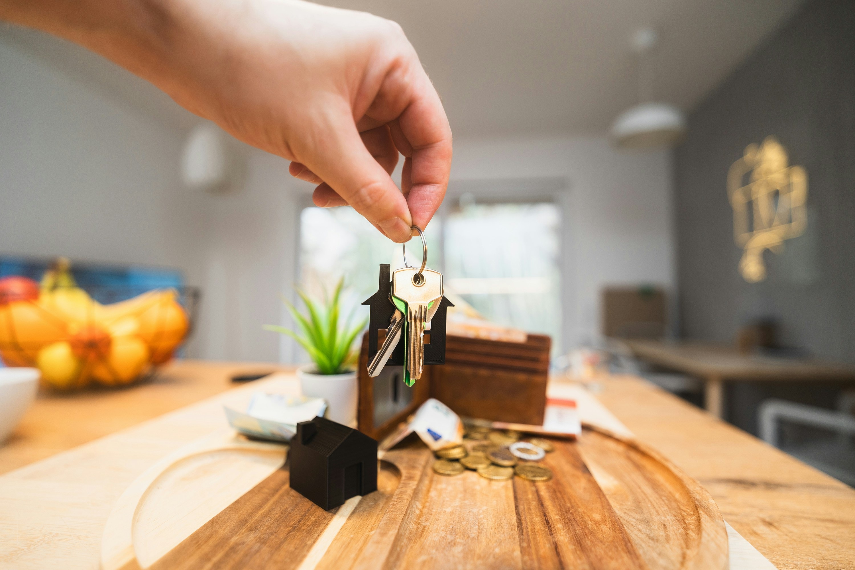 House keys held by new homeowner of historic house. 