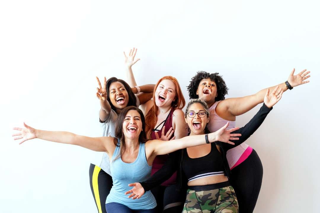 Five women celebrating health and energy, featured in 'Top 10 Supplements To Boost Immune System Now'. The blog emphasizes how supplements like vitamin C and D can help boost your immune system, improve immune response, and fight off upper respiratory infections.