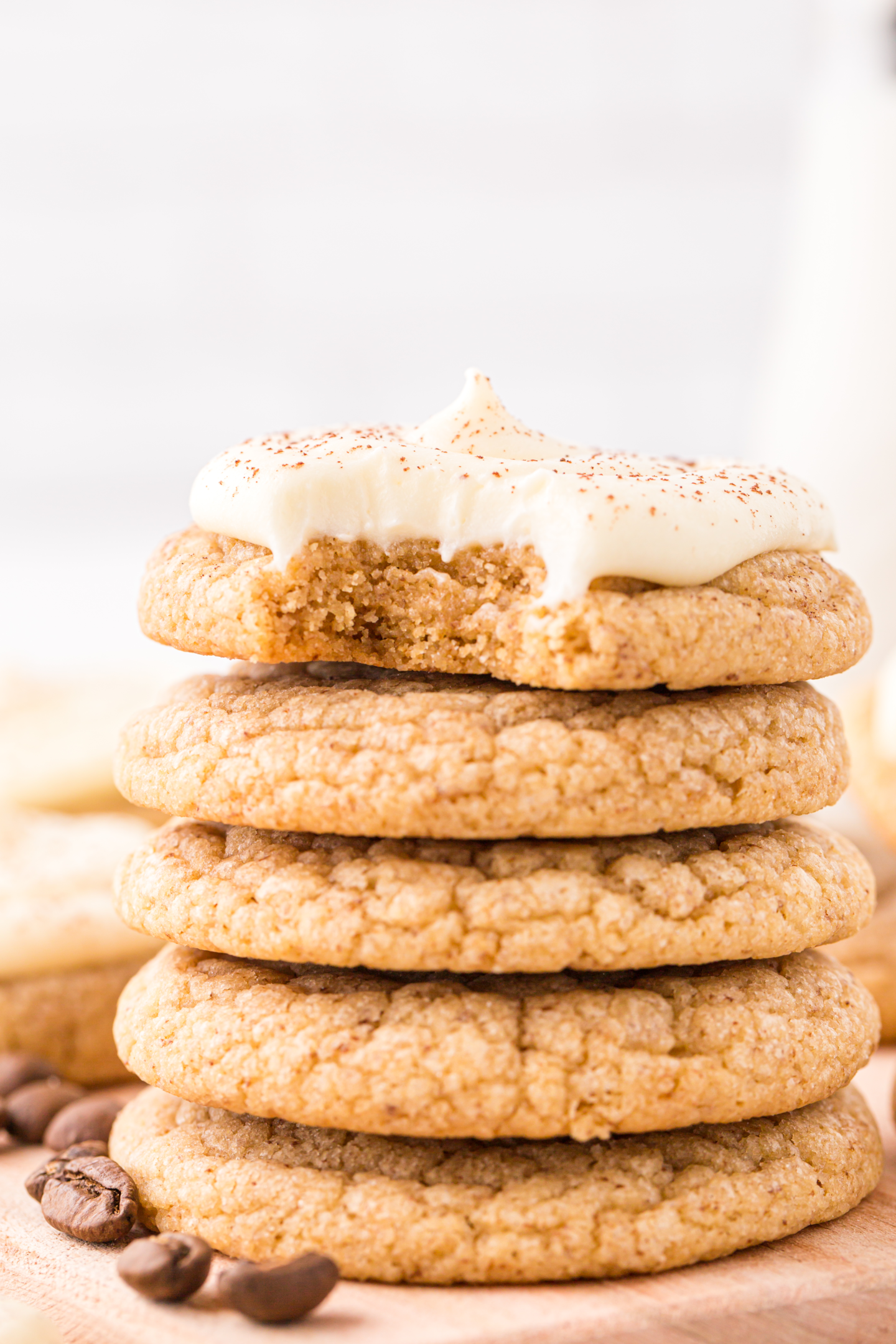stack of tiramisu cookies, with top cookie missing a bite