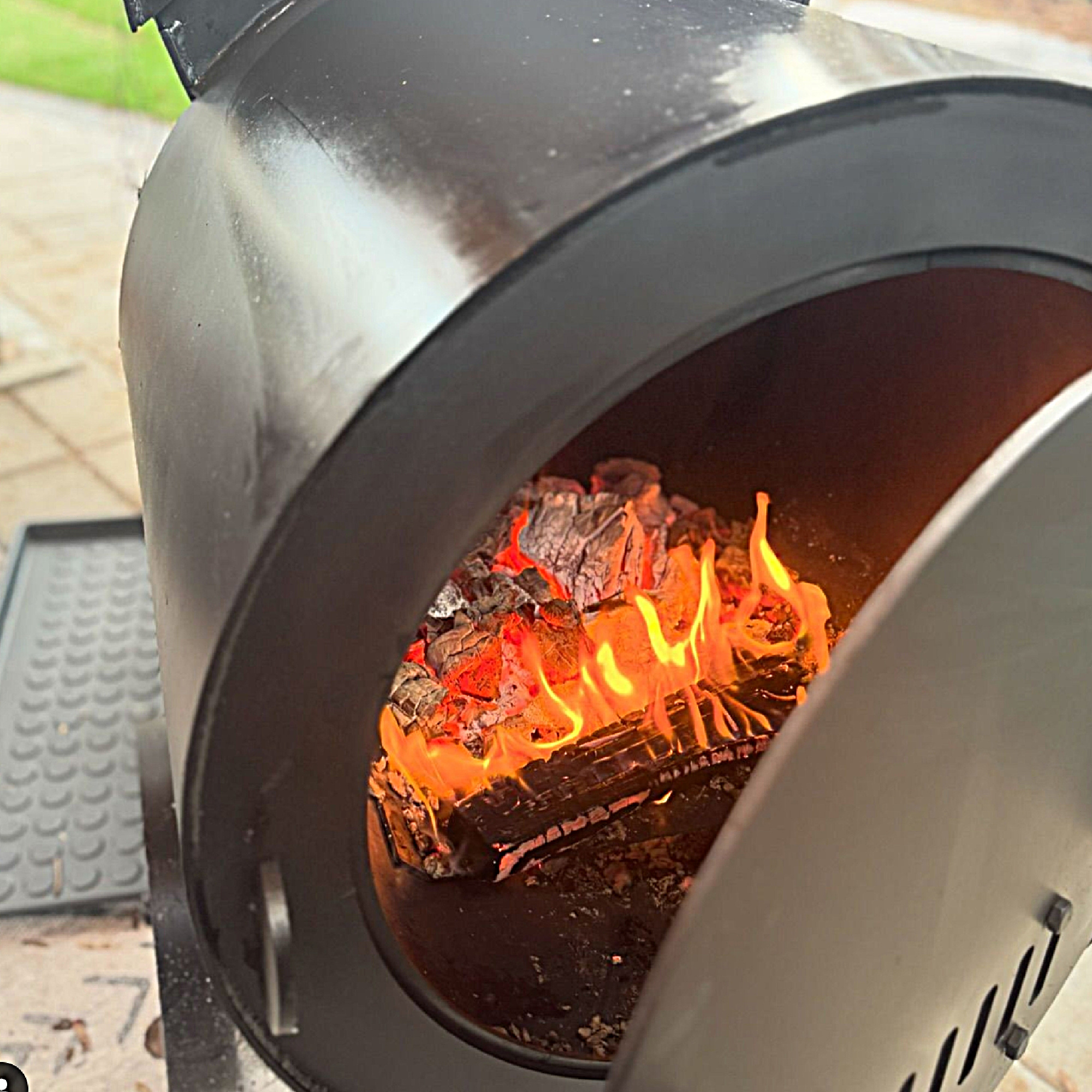 Igniting charcoal in a firebox of an offset smoker