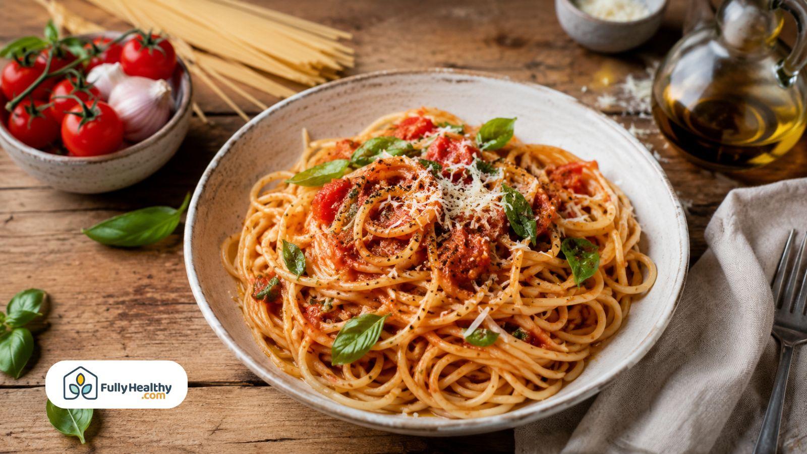 Bowl of spaghetti with tomato pasta sauce basil parmesan and olive oil