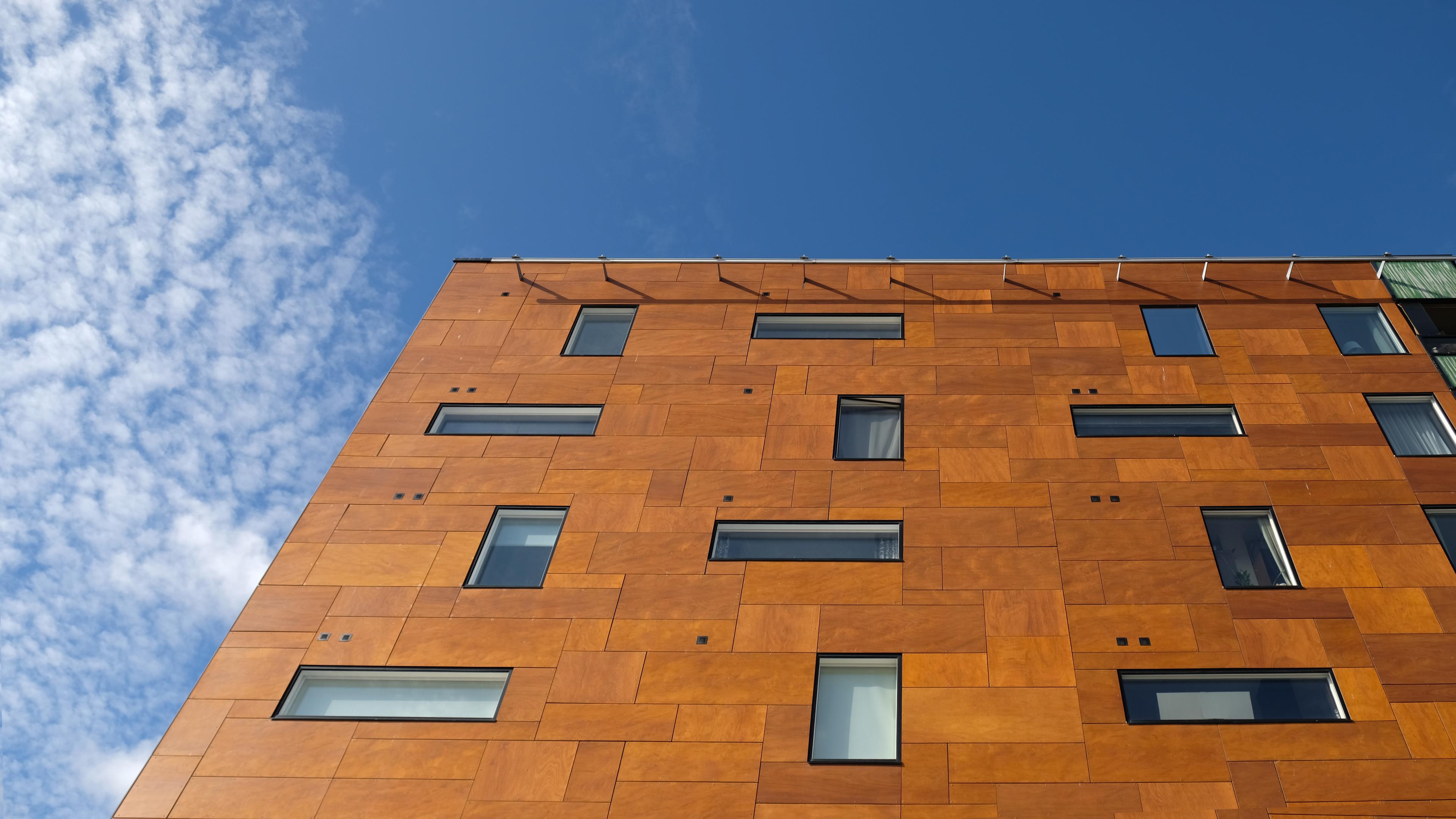 Exterior of modern brown house object. Architectural detail of a skyscraper, close-up on the windows