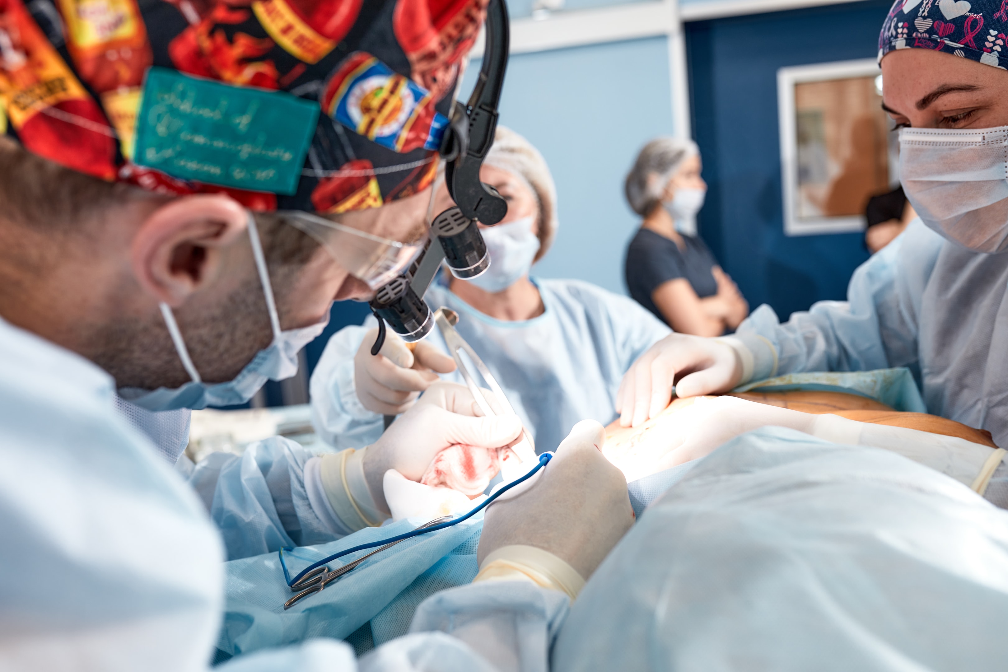 An image of an oral and maxillofacial surgeon during corrective jaw surgery