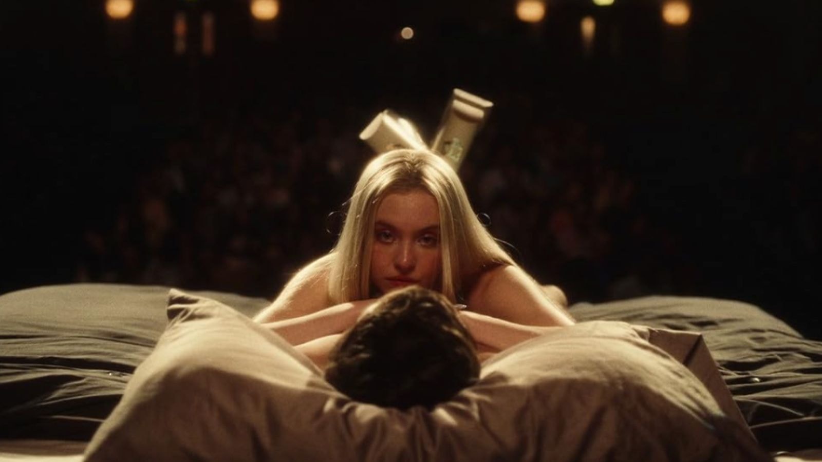 Sydney Sweeney as Cassie lying onstage bed during school play in Euphoria Season 2