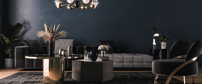 This Hollywood glam style living room features metallic accents, dark furniture, dramatic lighting and black walls.