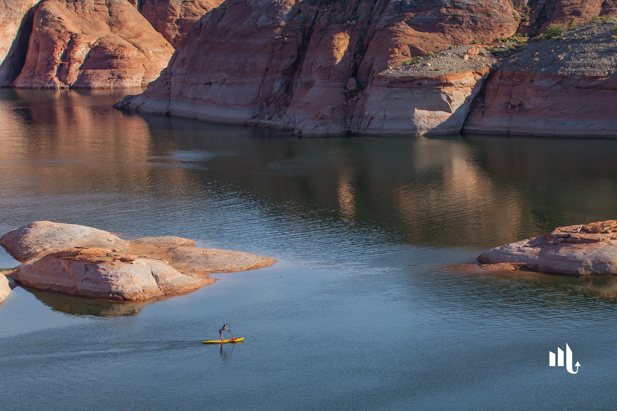 woman on stand up paddle board