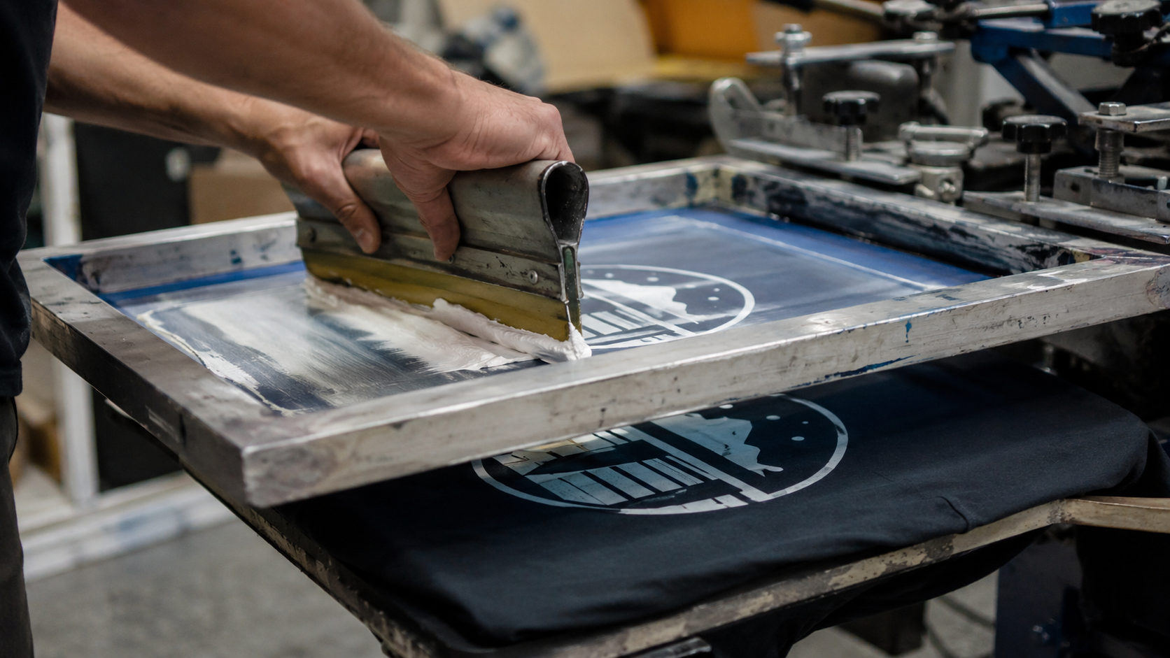 Screen printing process for custom logo T-shirts using mesh screens and plastisol ink