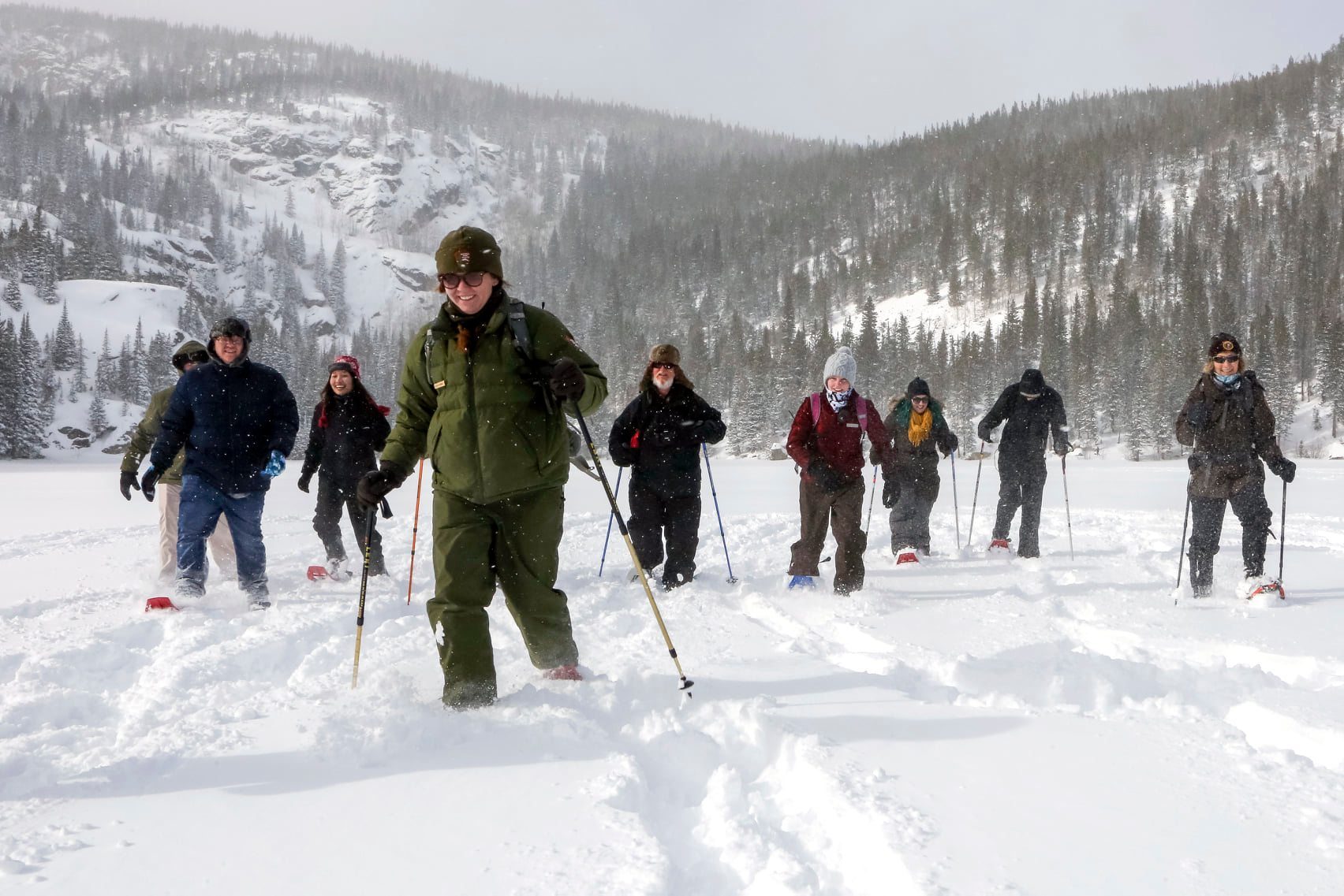 A ranger leading a snowshoeing tour at Rocky Mountain National Park 