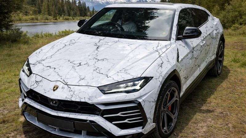 A car wrapped in white marble car wrap