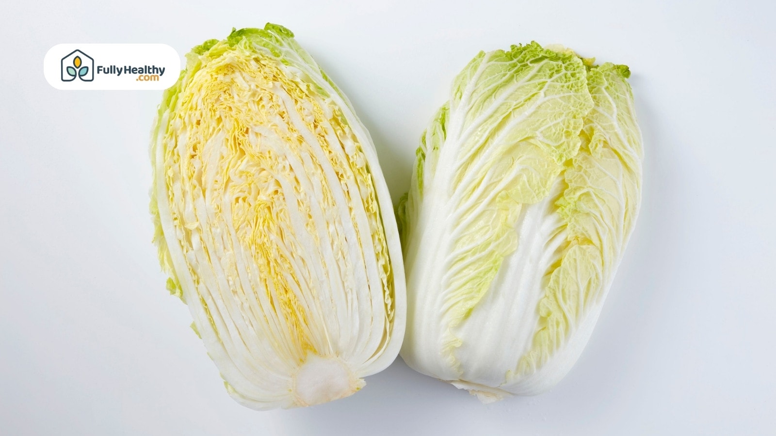 Halved napa cabbage showing crisp white and yellow layers inside