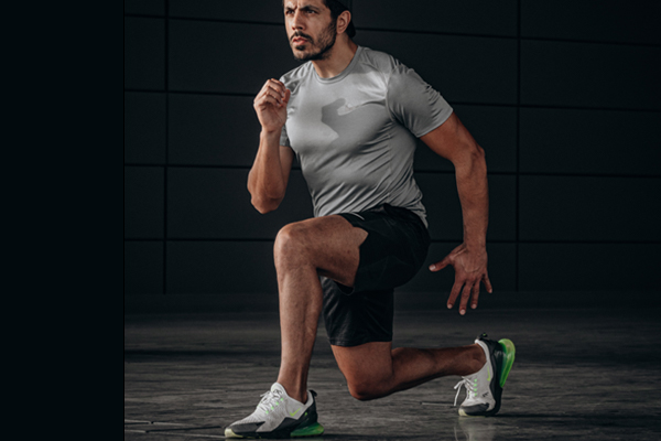 man doing exercise - ankle stretching muscles and tendon