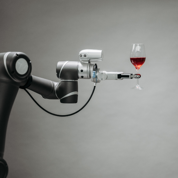 This photo shows a service robot offering a glass of wine