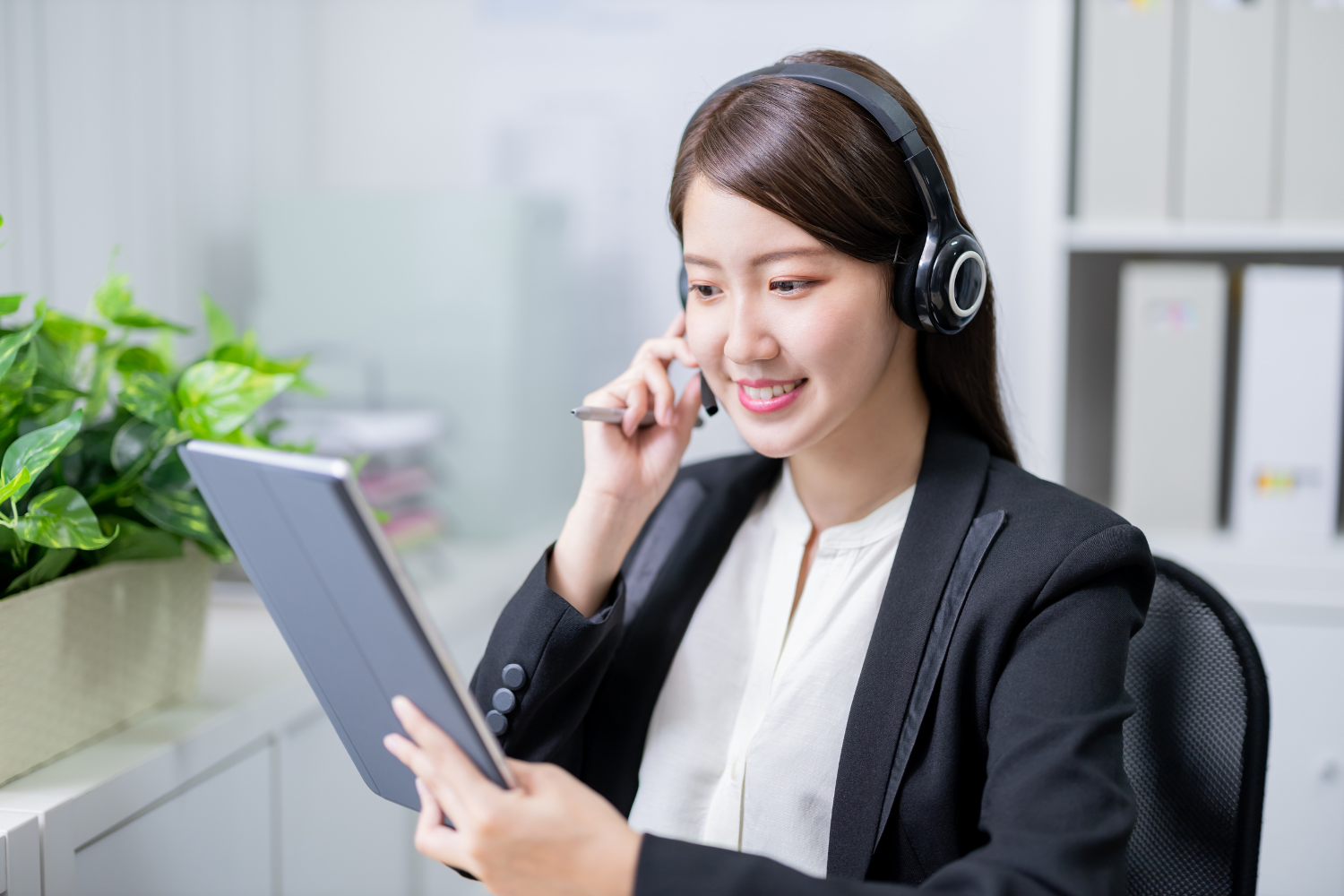 A remote employee wearing a headset.