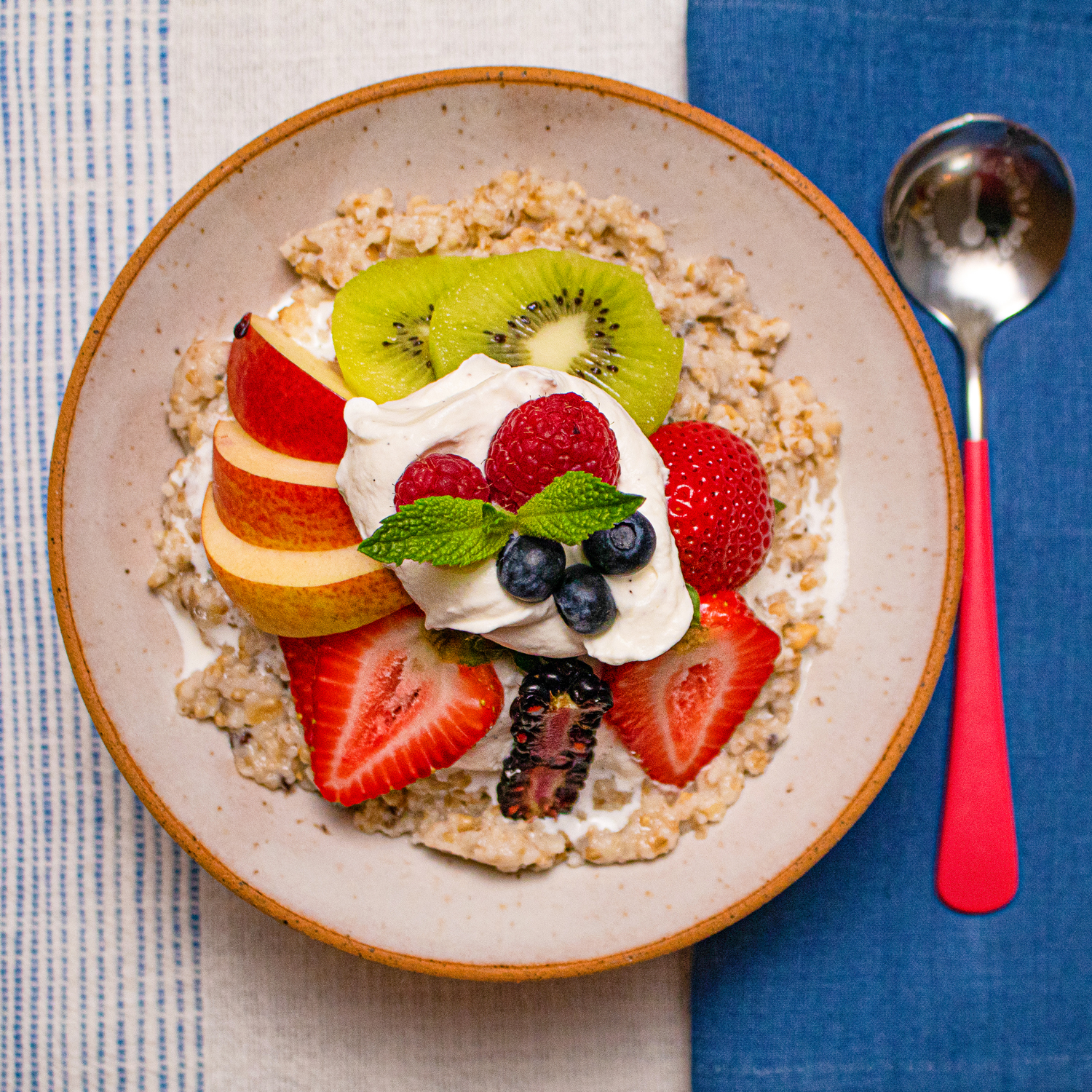 Proper Good's Perfectly Plain Oatmeal under a blanket of fruits and cream