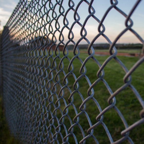 An image showing chain link fencing with vinyl coating in Phoenix.