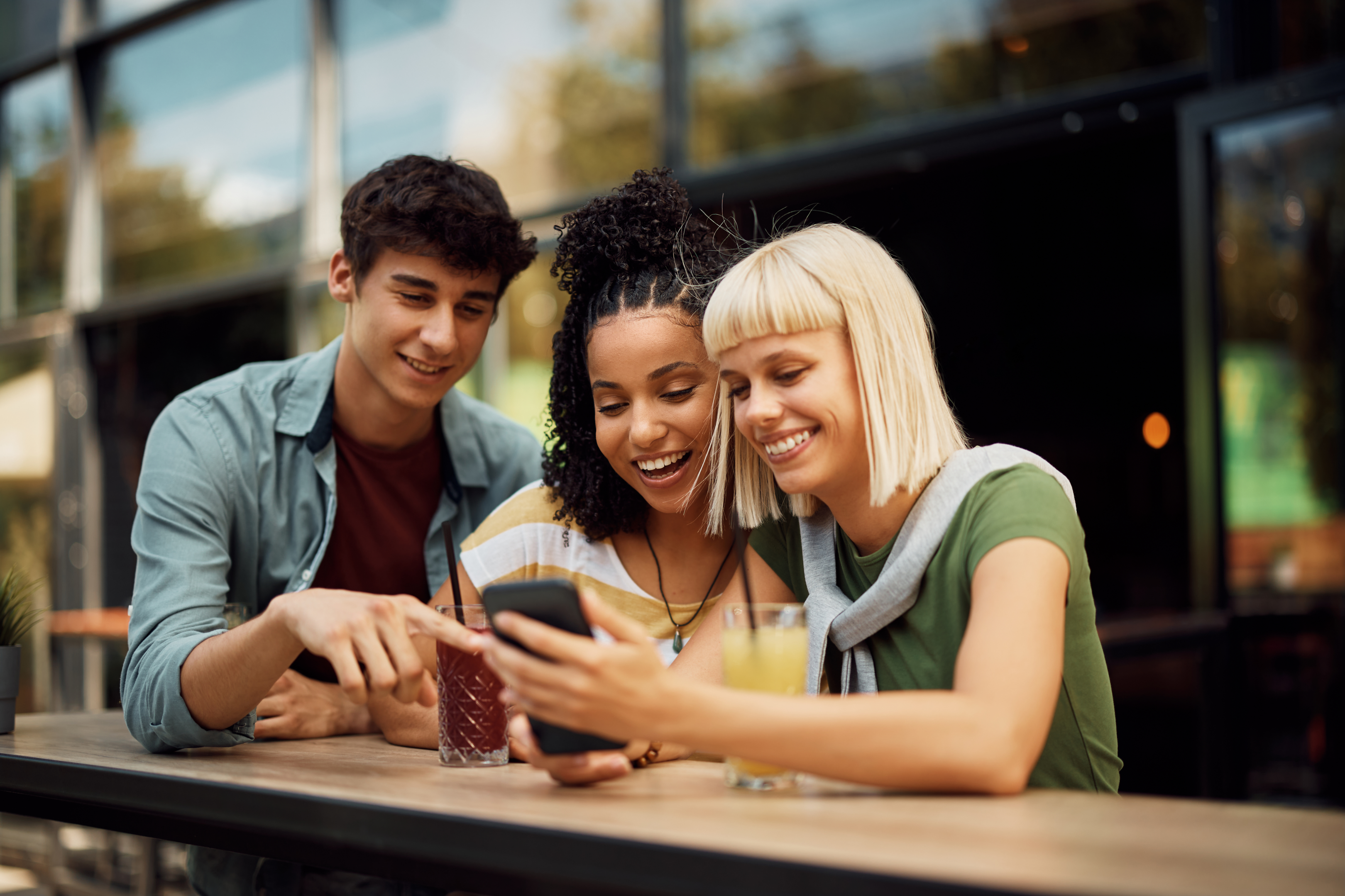 Group of friends watching a video on mobile