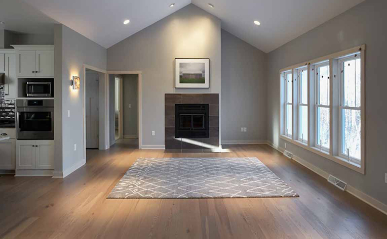 Neutral grey paint with white cabinets in an open kitchen and living room, perfect home remodel for increasing resale value