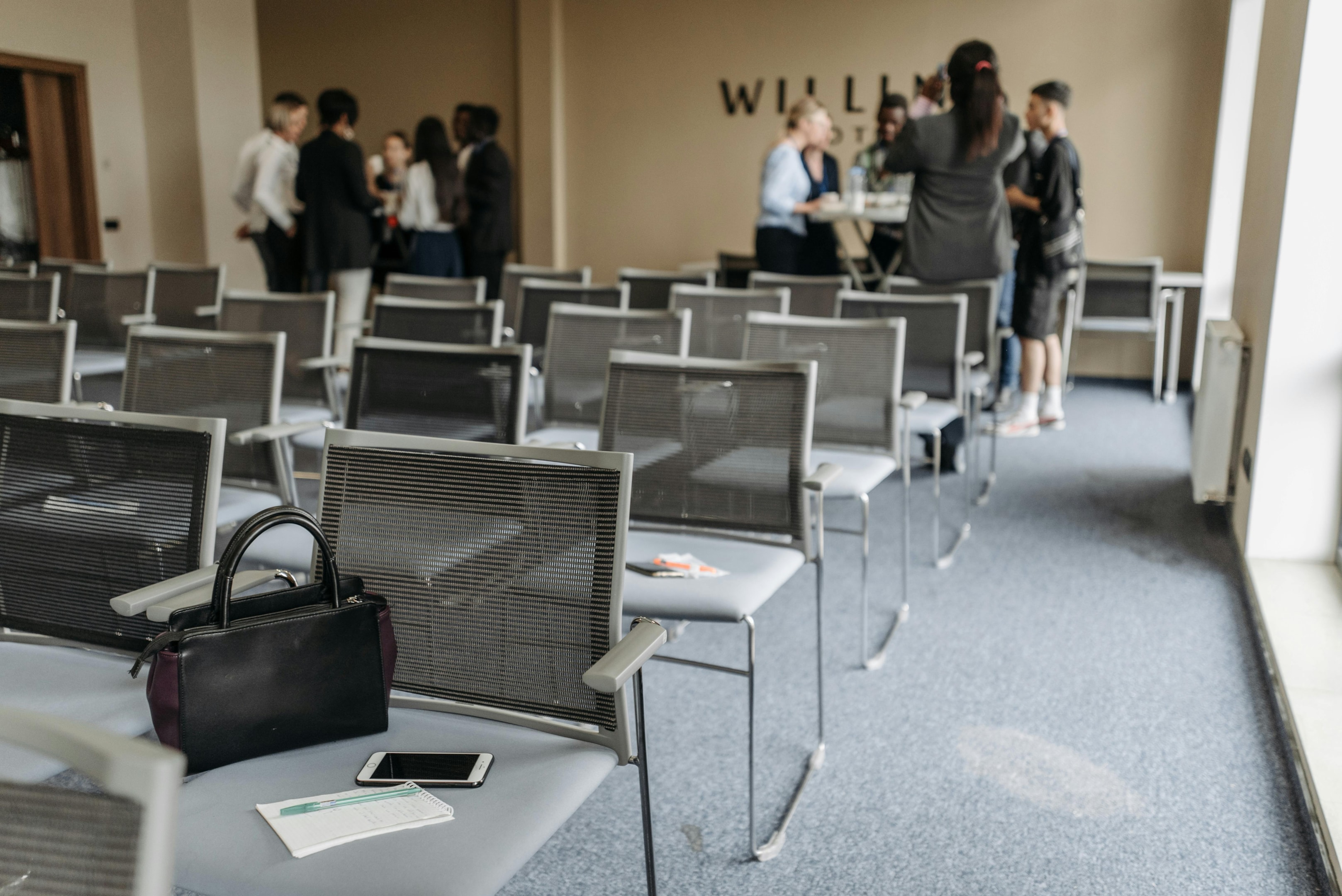 Real estate investors and wholesalers network at a local event in order to build connections in the business.