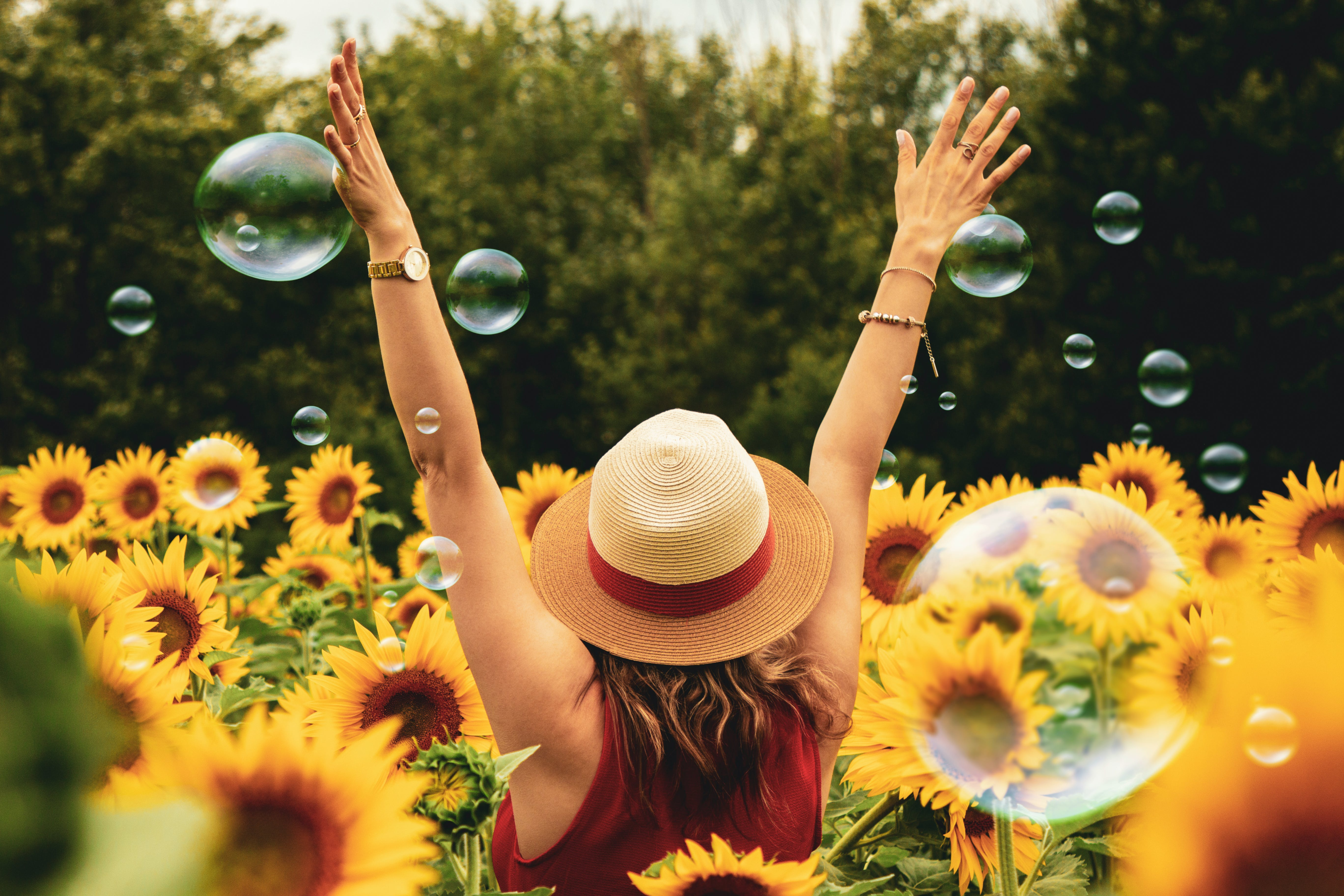 woman with sunflowers symbolizing how potential customers can be captured with helpful information and relevant keywords