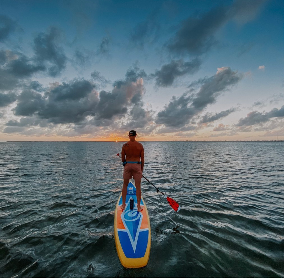 man on a stand up paddle board