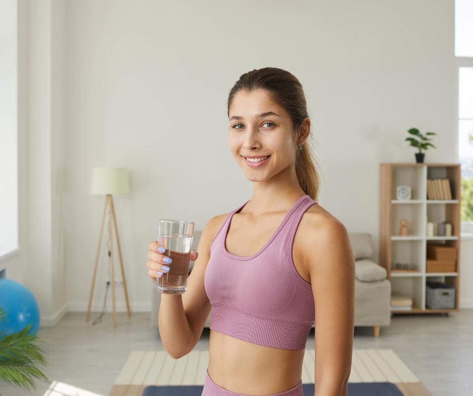 A person celebrating tips for staying sober with a glass of water