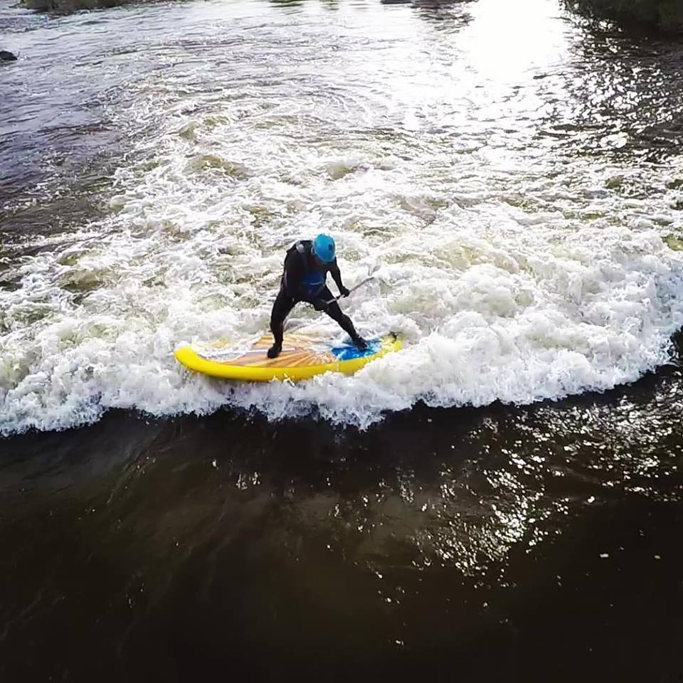 stand up paddle boarding on the river