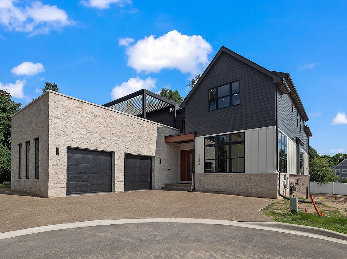 Natural elements such as stone work well with modern pergolas.