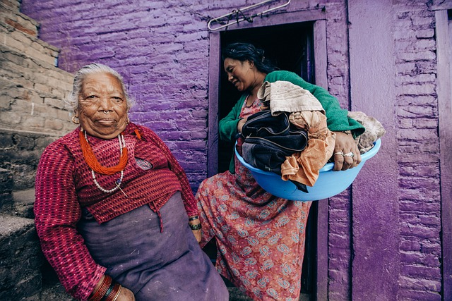 This woman's name is Laxsmi. She is holding back a laugh because of course Nepal is worth visiting!
