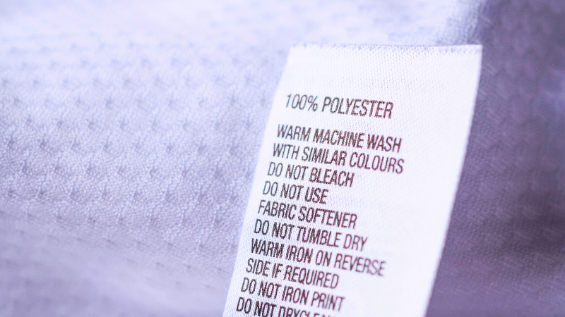 A close up picture of a white polyester shirt
