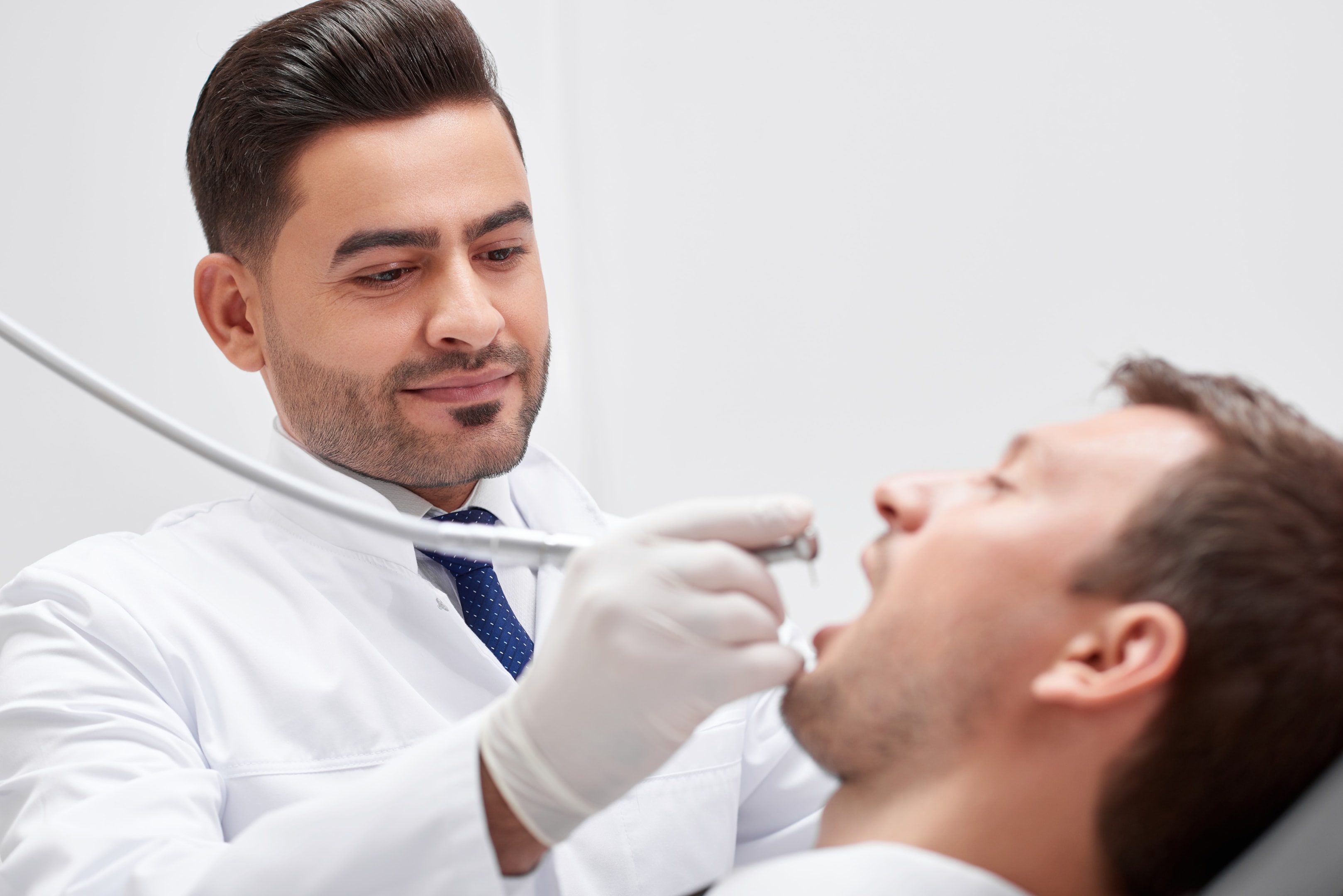 Oral Surgeon checking patient to see if corrective jaw surgery for underbite is needed