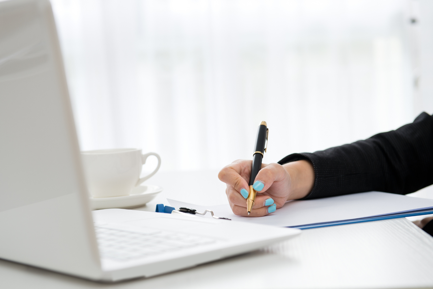 Hiring manager actively listening and taking notes.