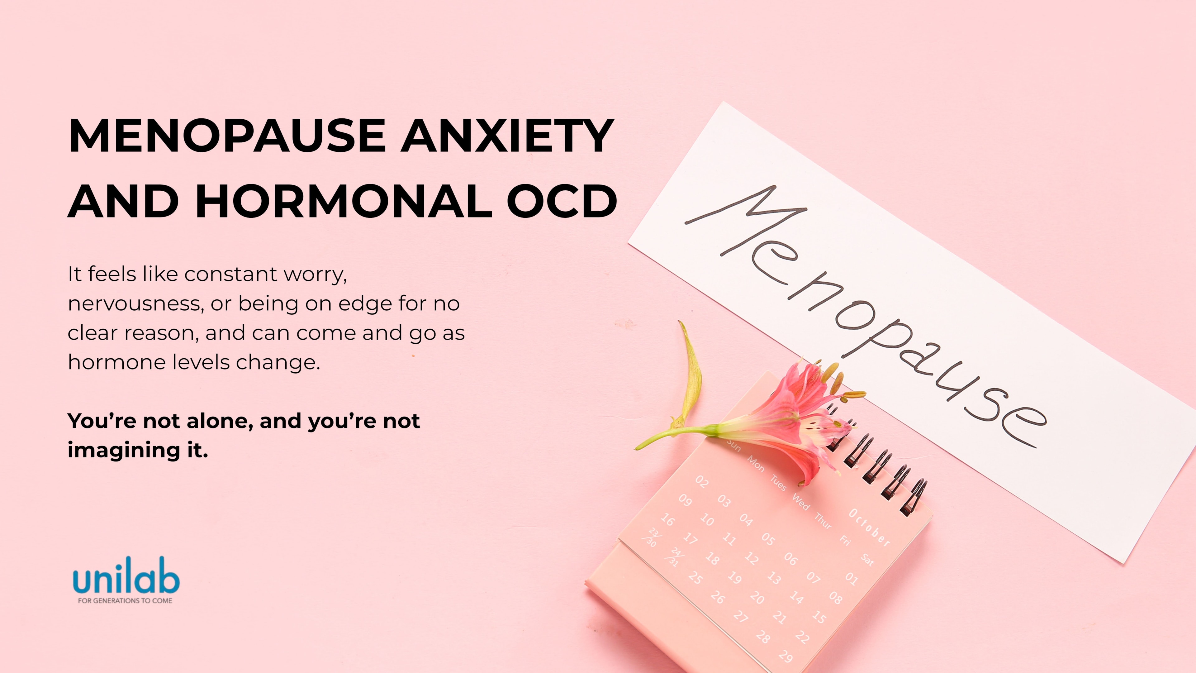 Menopause written on a white piece of paper with a pink calendar and a pink background.