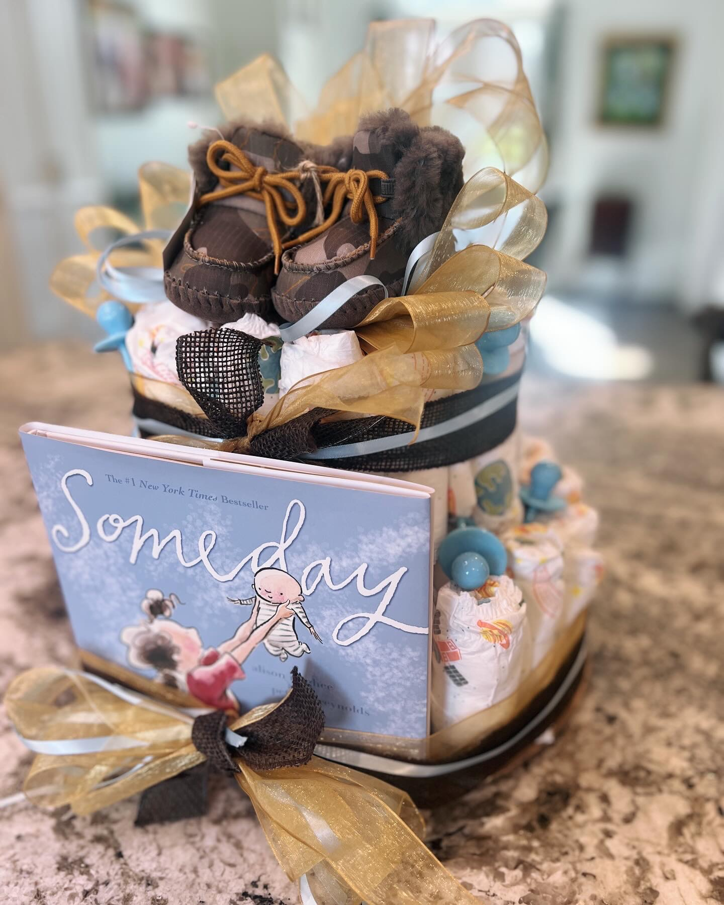 Baby shower gifts - diaper cake can be made with disposable or cloth diapers - add baby booties, teething toys and other items