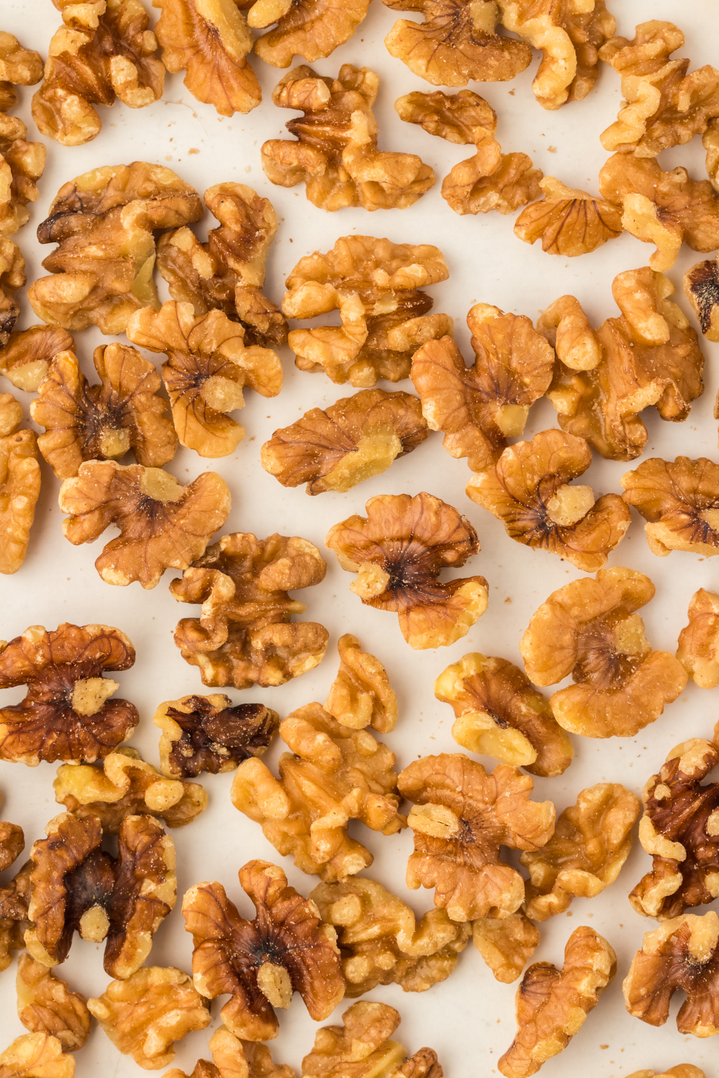 toasted walnuts on a baking sheet