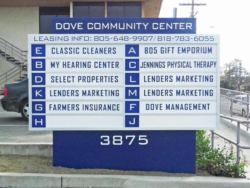 Dover Community Center business directory sign uses outdoor lightboxes so they can be seen at night.