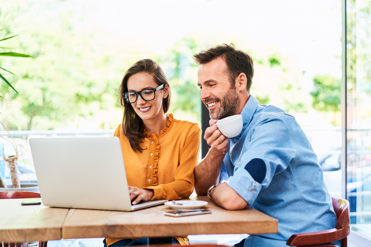 Business owners looking at something on their laptop.