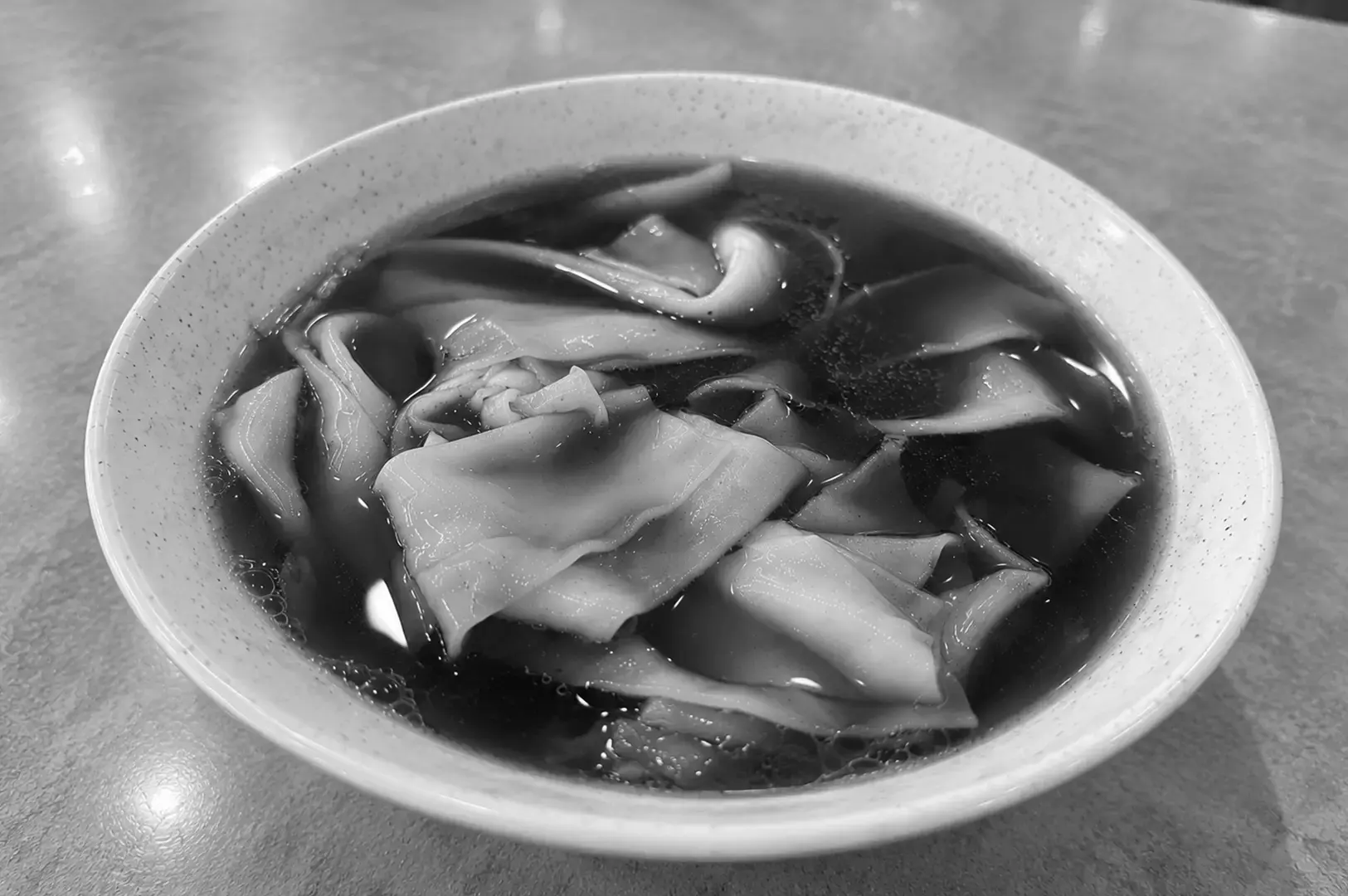 A plate of broad, silky rice sheets accompanied by braised meat and offal, a familiar combination at Singapore kway chap stalls.