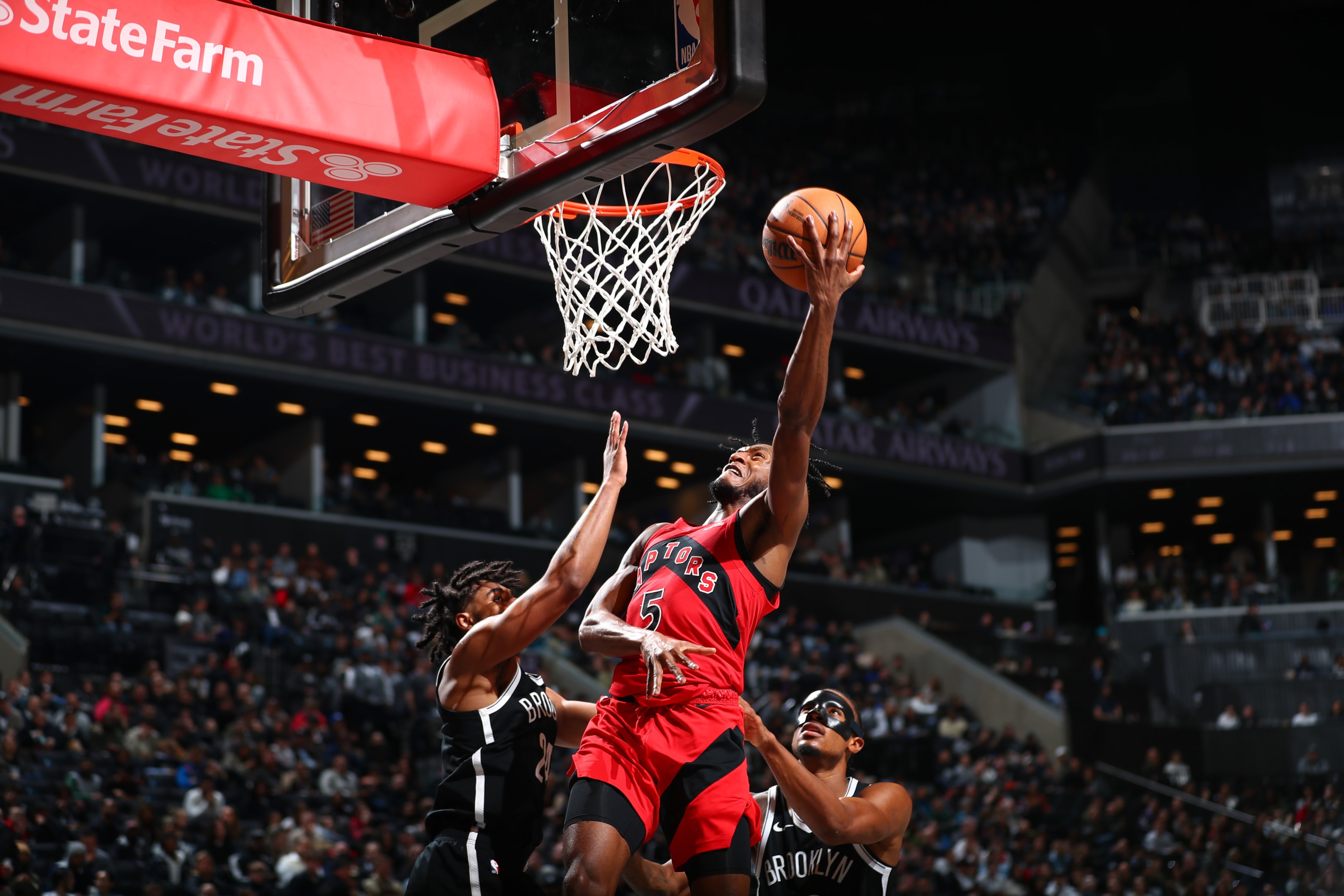  Immanuel Quickley of the Toronto Raptors goes to the basket during a game on April 10, 2024 at Barclays Center in Brooklyn, New York.