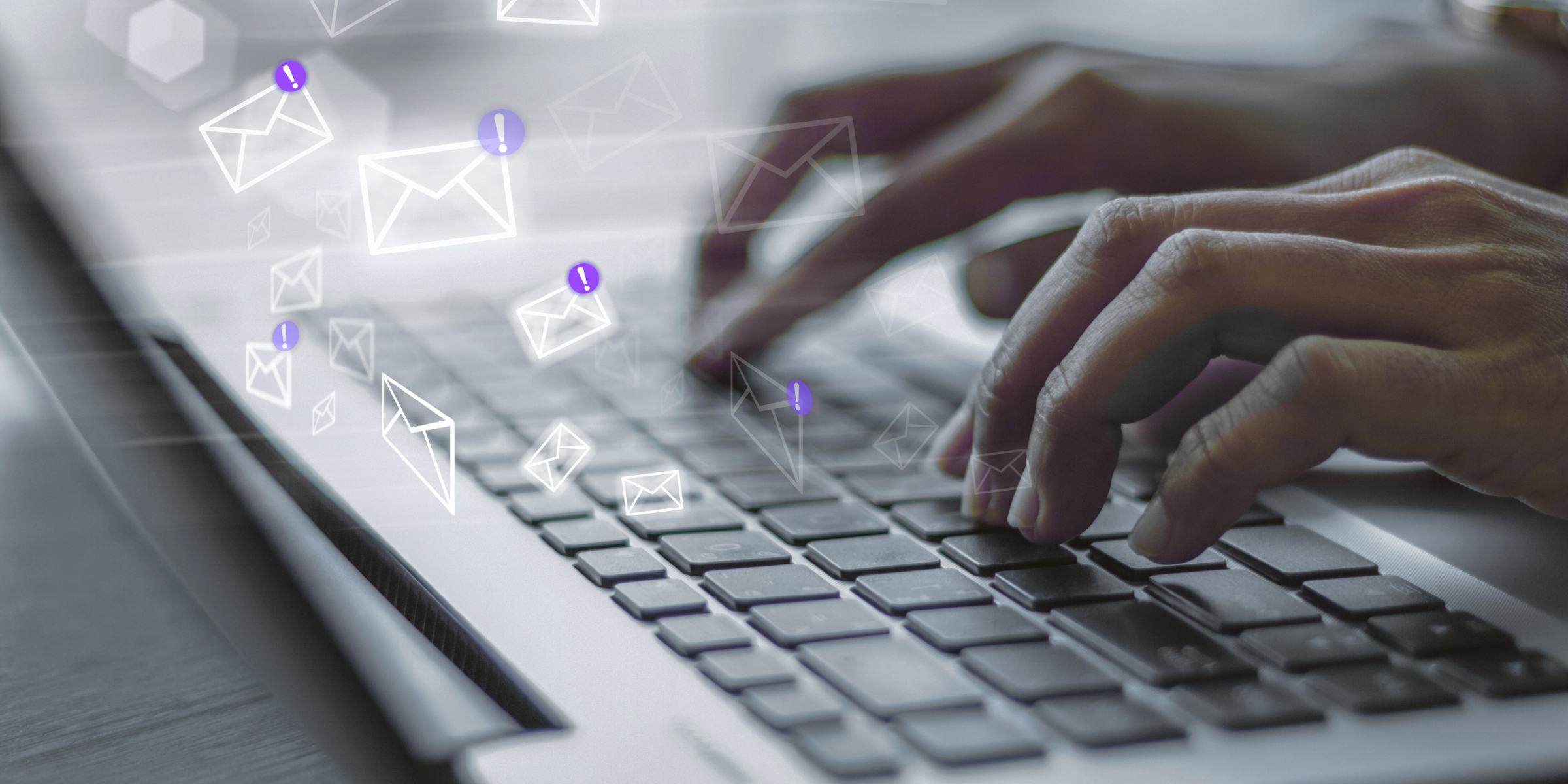Close-up of hands typing emails on a laptop with digital communication icons, representing written communication, asynchronous communication, and the importance of consistent communication among remote teams.