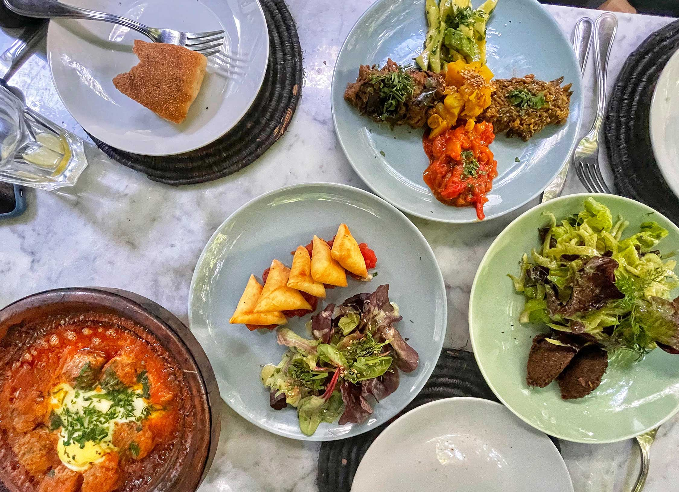 A colorful Moroccan table with traditional Moroccan foods