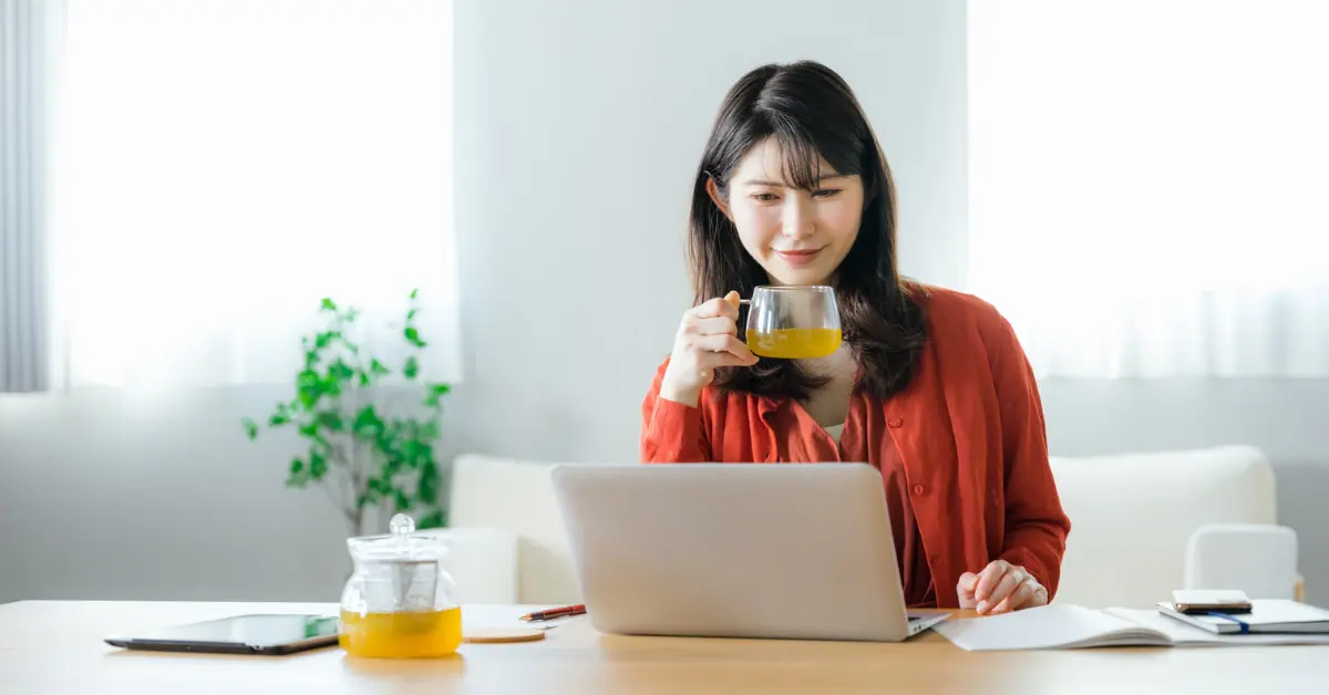 A successful creator reviewing her bank reconciliation statement to track her monthly earnings.