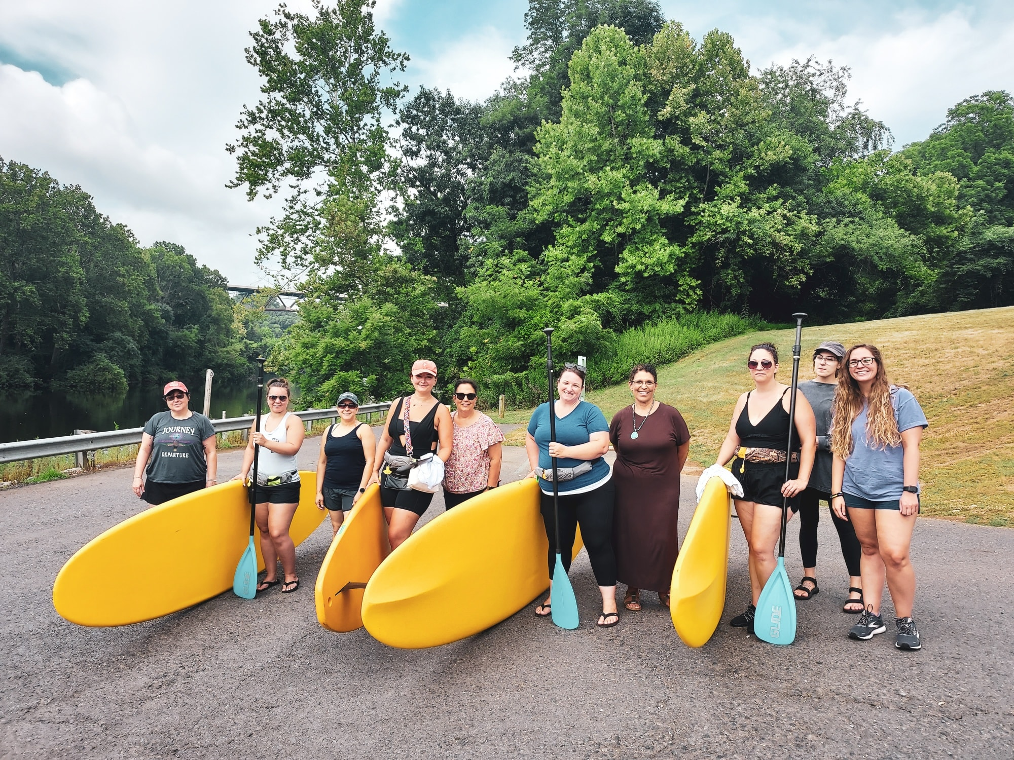 group of women with paddle boards