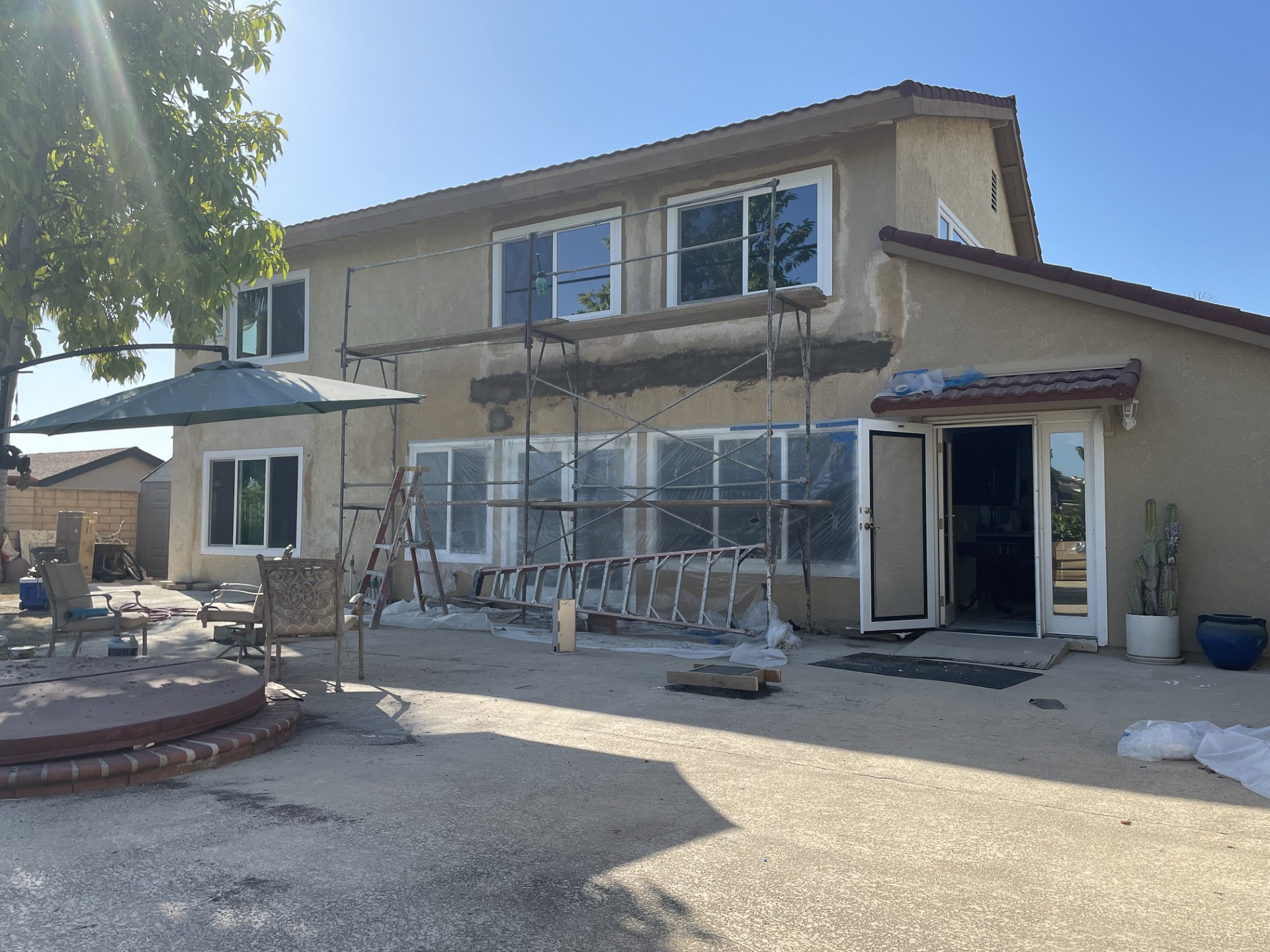 Attached pergola contruction underway. Customer replaced a wooden pergola with an aluminum one.