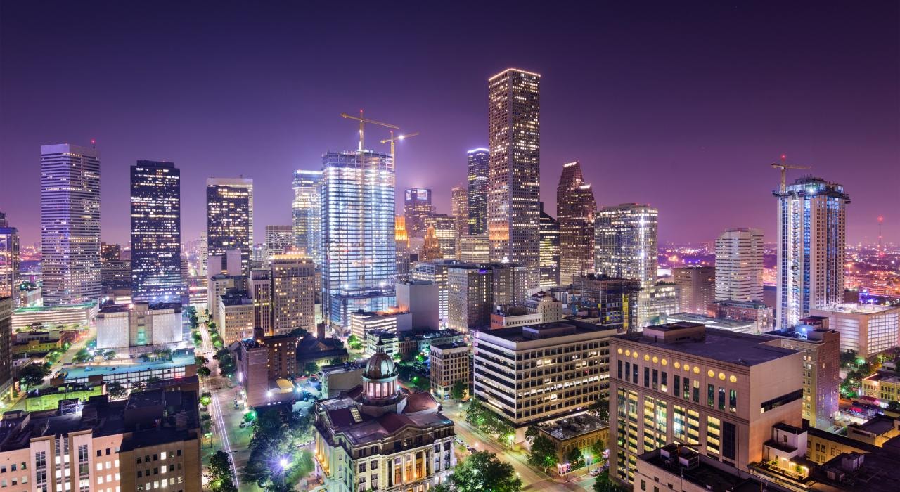 Houston skyline at night, reflecting how many businesses depend on reliable Internet, network capacity, and cloud computing to avoid network issues.