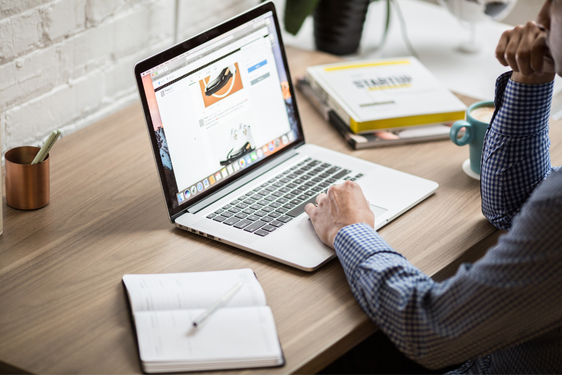 Reviewing sample virtual assistant task for email management on laptop