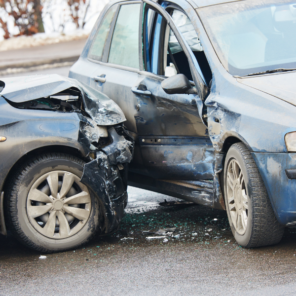 An image showing a serious car accident with injured victims and emergency responders.