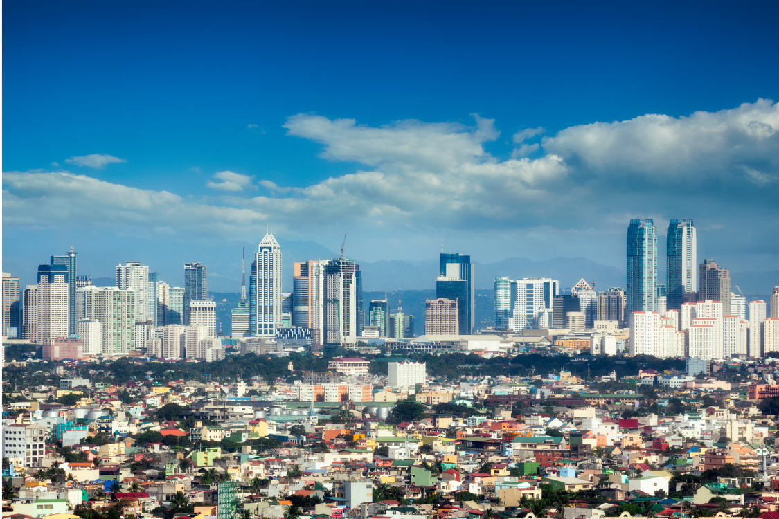 Skyline of Metro Manila’s business district with high-rise buildings, symbolizing the region’s status as a corporate and outsourcing hub.