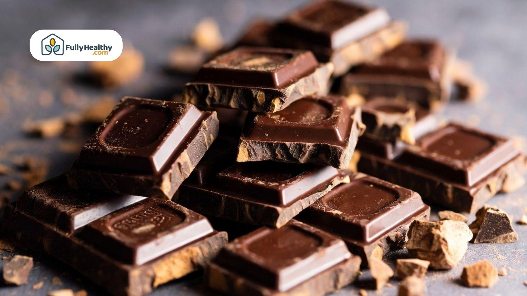 Stacked chocolate pieces with visible texture and crumbs.