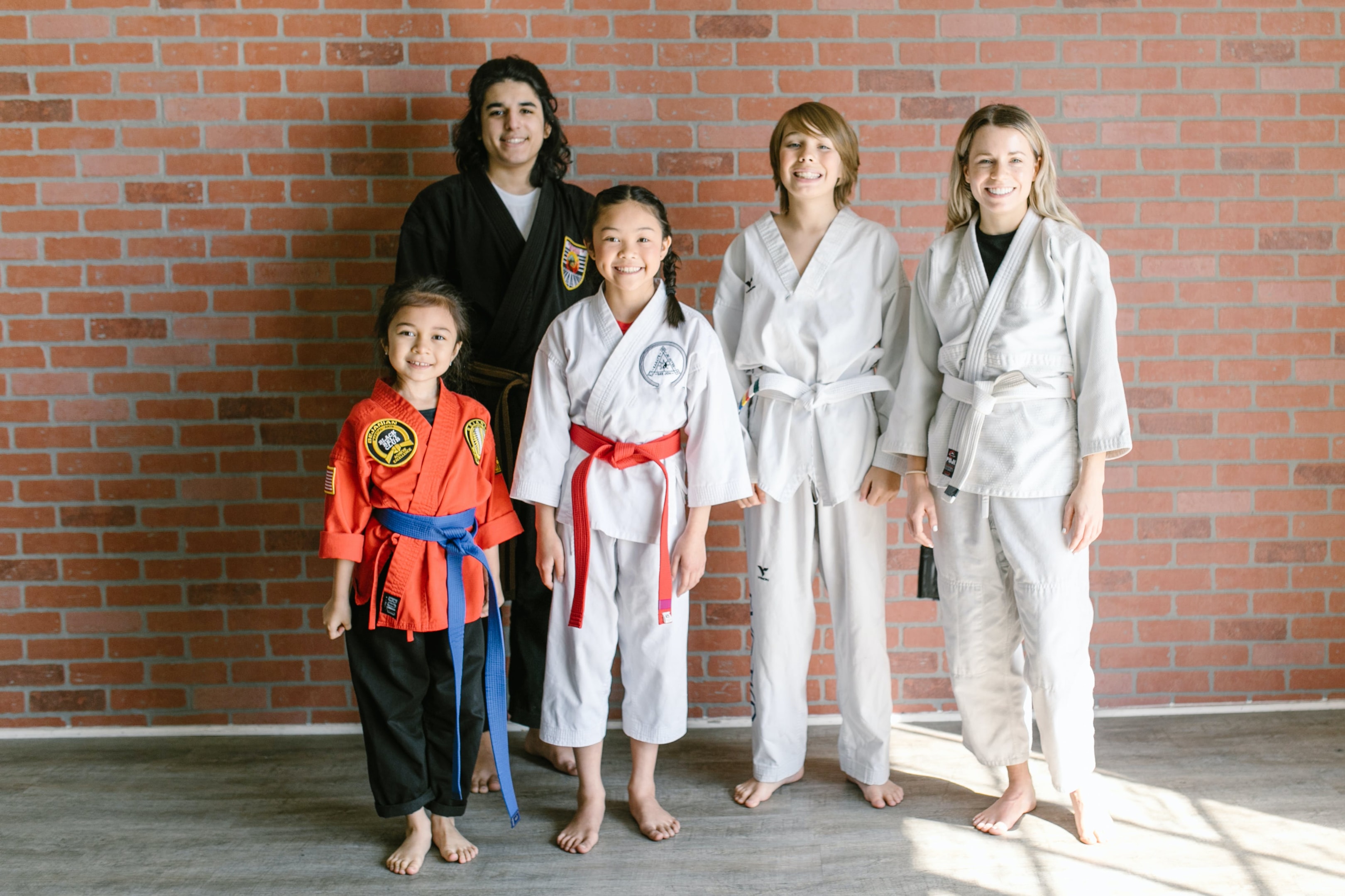 Kids martial arts program building confidence by celebrating achievements at special events, while also teaching them to follow instructions.