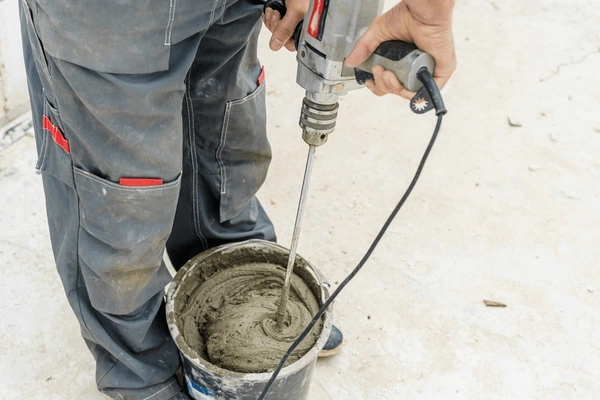 Person choosing the right drill mixer for a home project